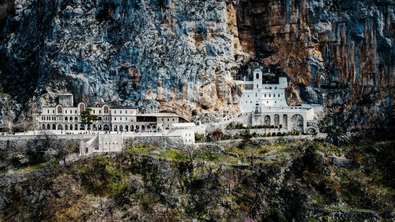 A stunning view of Ostrog Monastery nestled in the cliffs of Montenegro.
