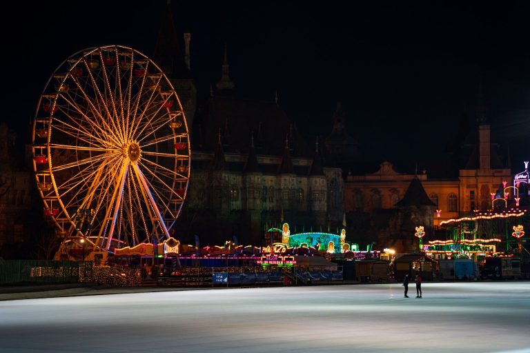 Magical winter evening with ice skating and a ferris wheel at Budapest's Vajdahunyad Castle.