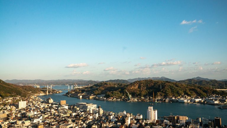 Stunning aerial panorama of Onomichi cityscape and waterfront in Hiroshima, Japan.