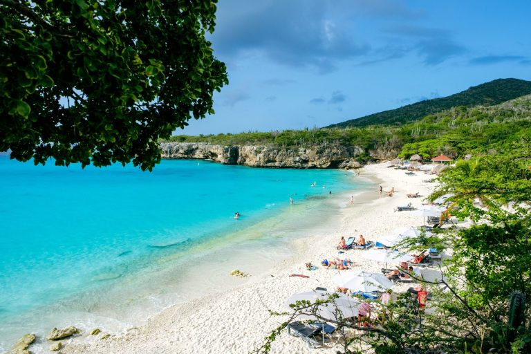 A beautiful tropical beach with turquoise water and white sand, perfect for vacations.