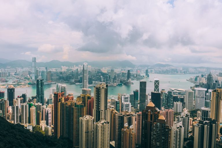 Panoramic view of Hong Kong skyline with skyscrapers and Victoria Harbour from Victoria Peak.